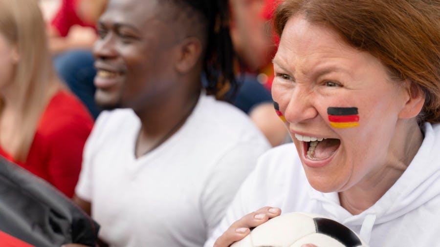 cheerful people watching football game 1